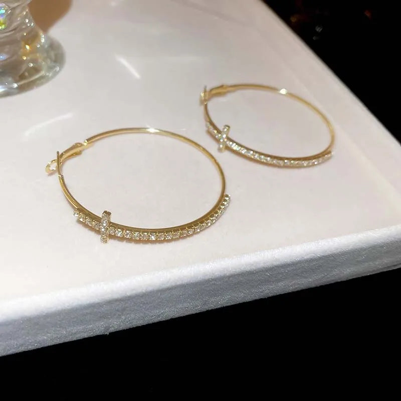 Boucle d’oreille croix