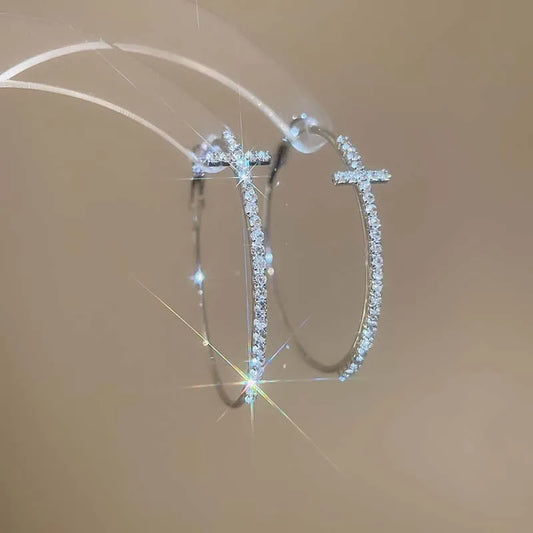 Boucle d’oreille croix